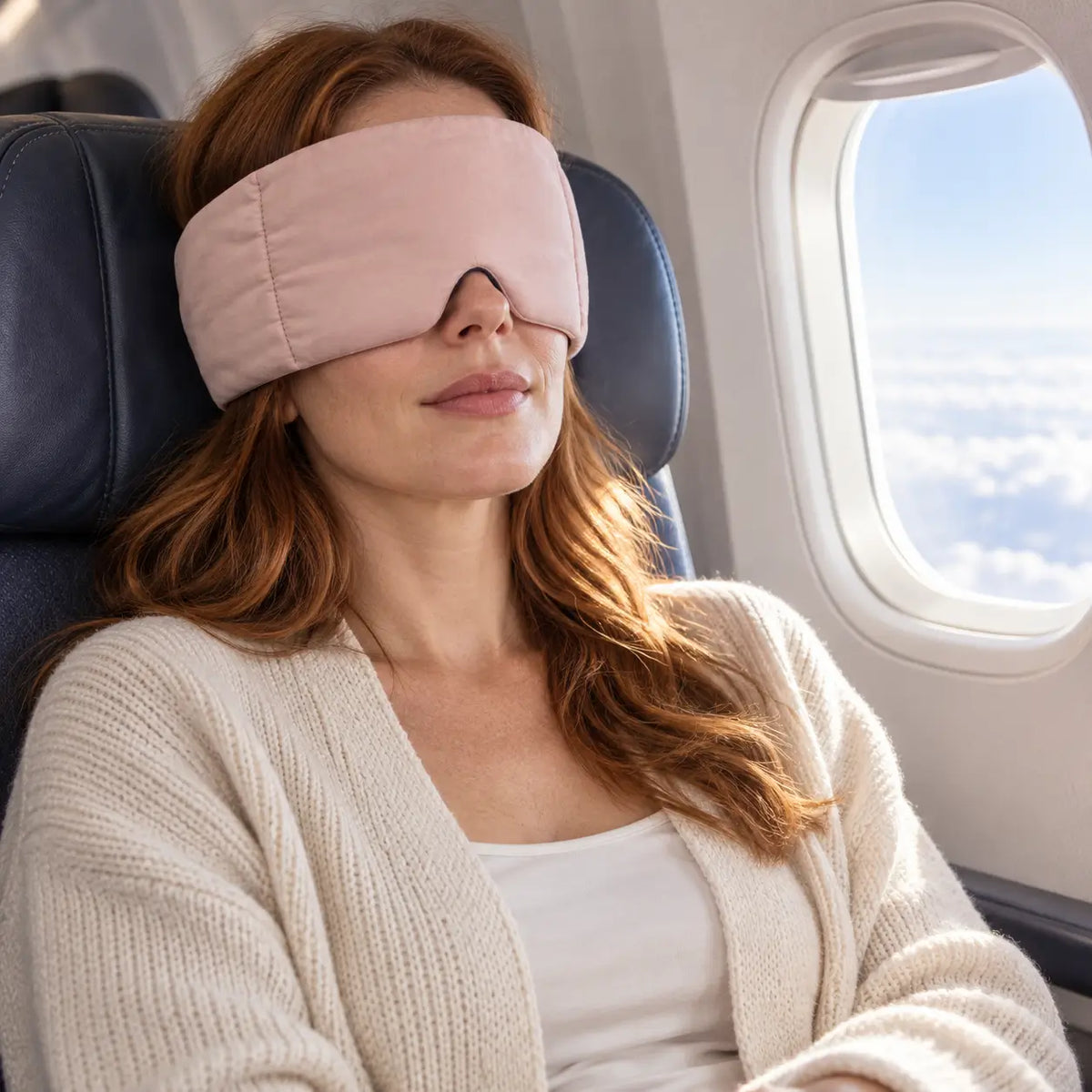 Customer wearing a CalmHug sleep mask