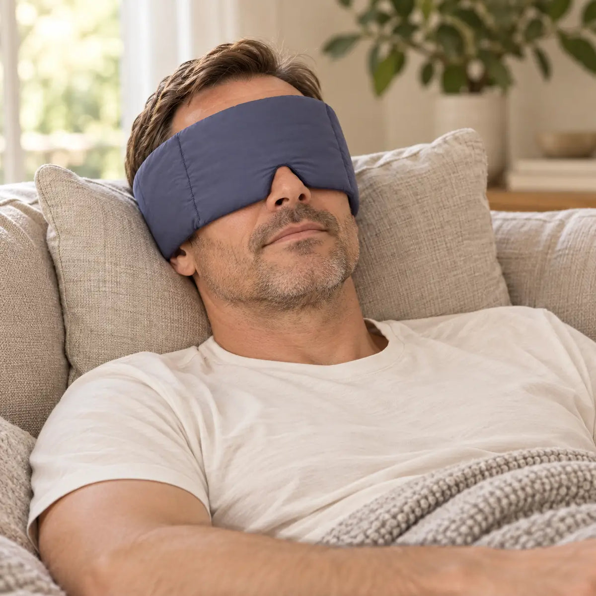 Customer wearing a CalmHug sleep mask