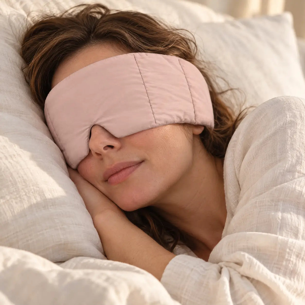 Customer wearing a CalmHug sleep mask